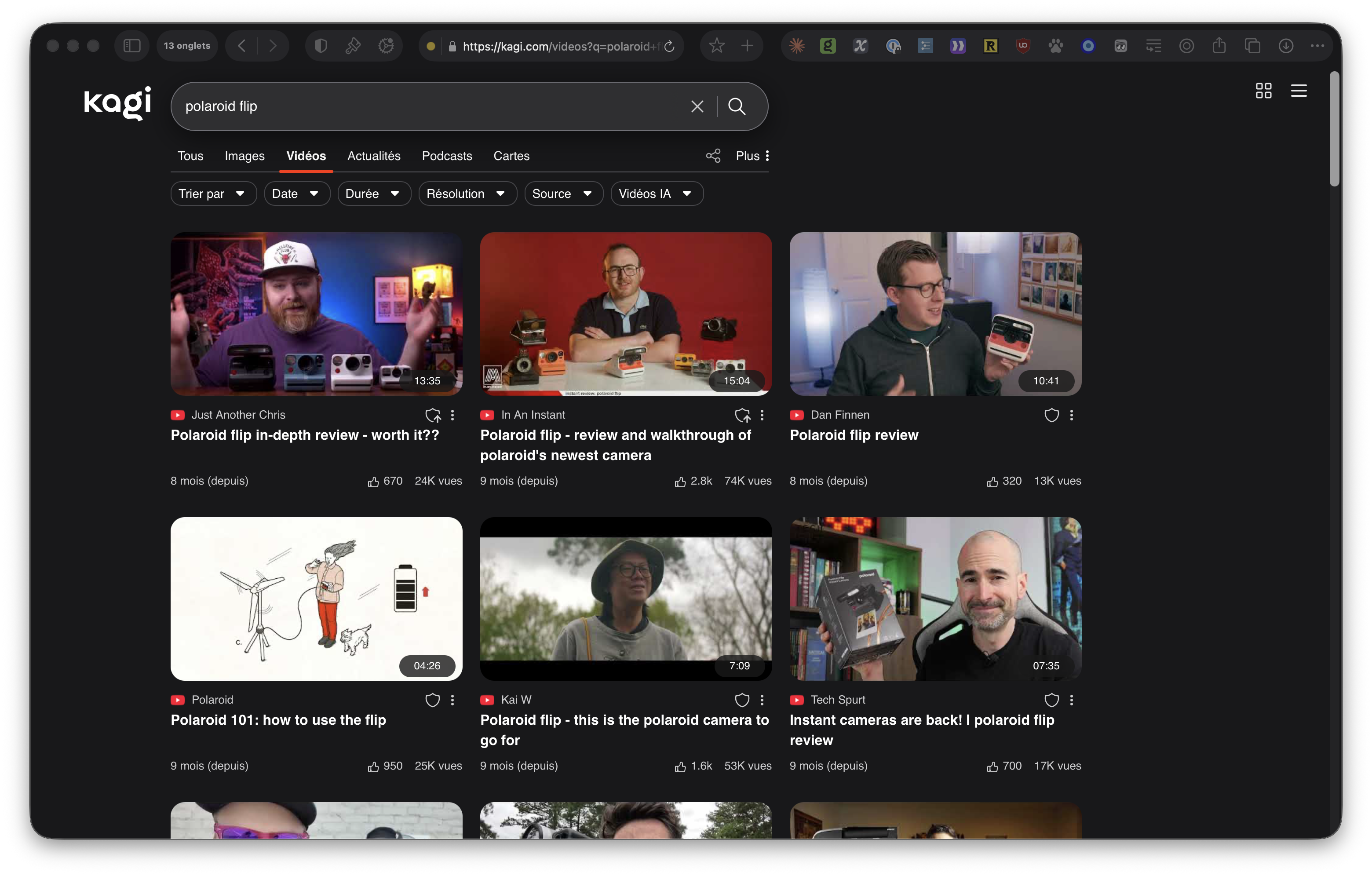 Kagi video search results page showing Polaroid Flip camera reviews with thumbnails and view counts, demonstrating an ad-free alternative to YouTube's homepage